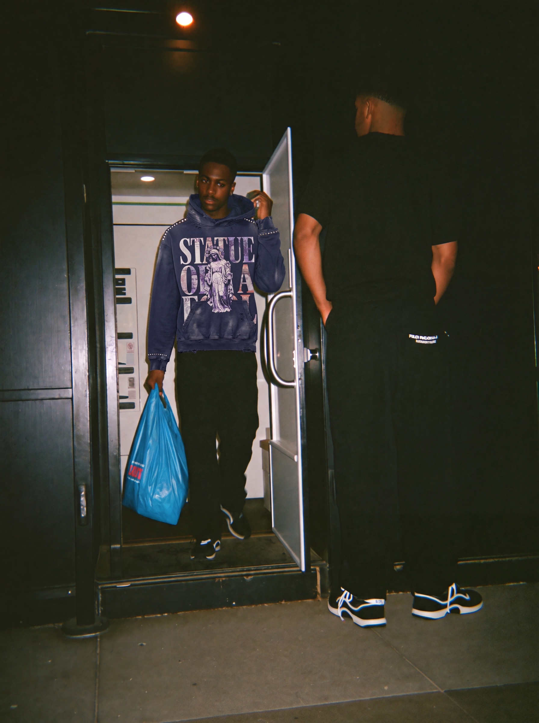 Statue of a Fool campaign: off-licence, hood, navy