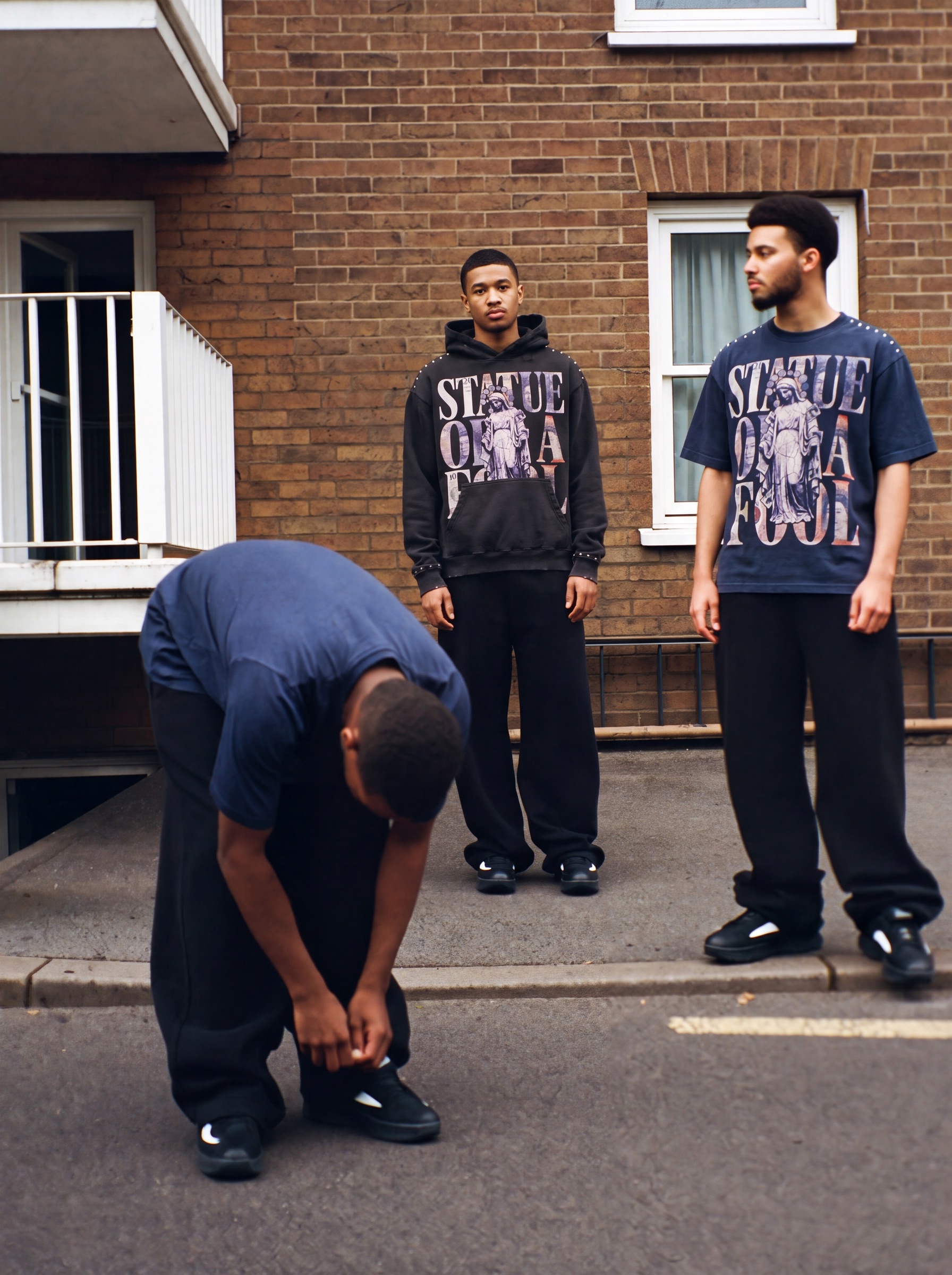 Statue of a Fool campaign: estate, daylight, hood, tee navy
